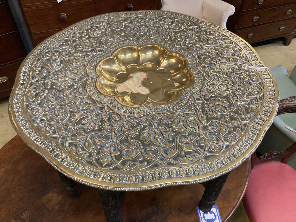 A Benares brass tray top table, 78cm diameter, 62cm high